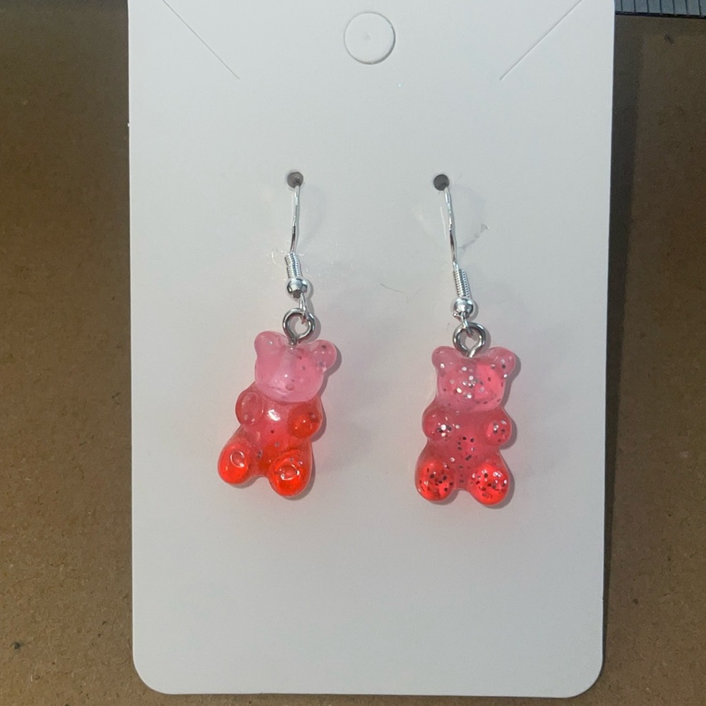 Homemade pink and orange gummy bear earrings with plastic backings